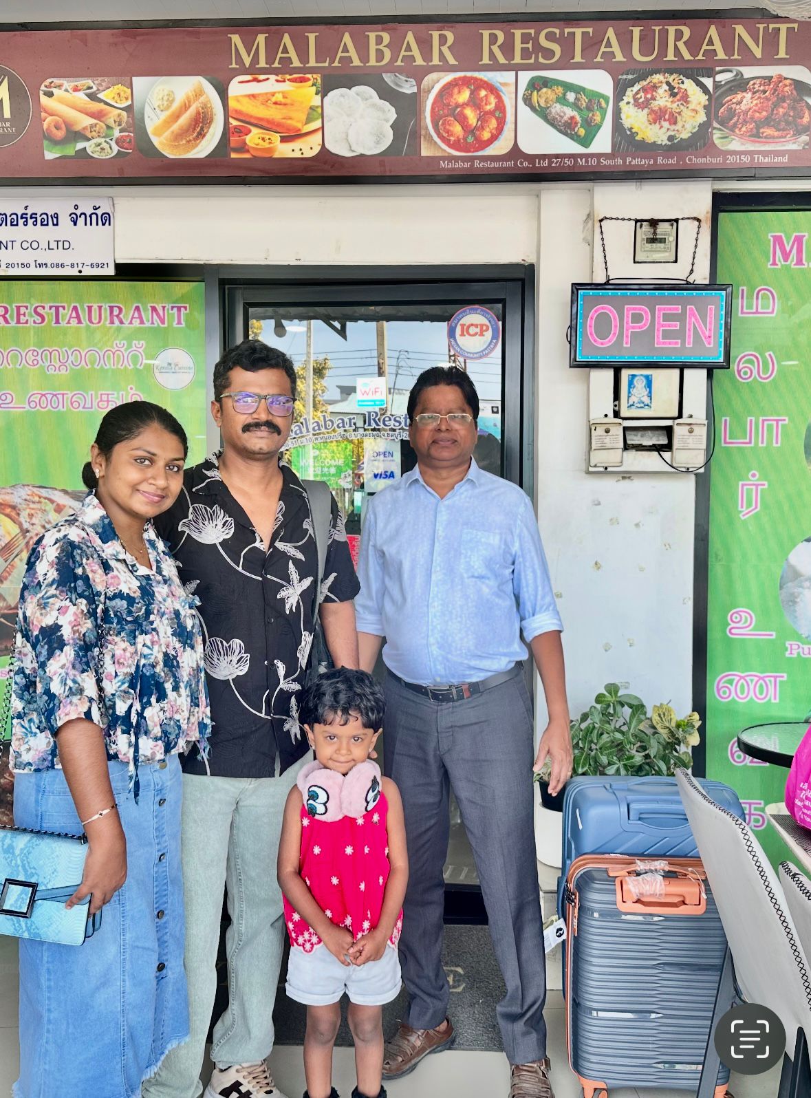 Family Photo Outside Entrance