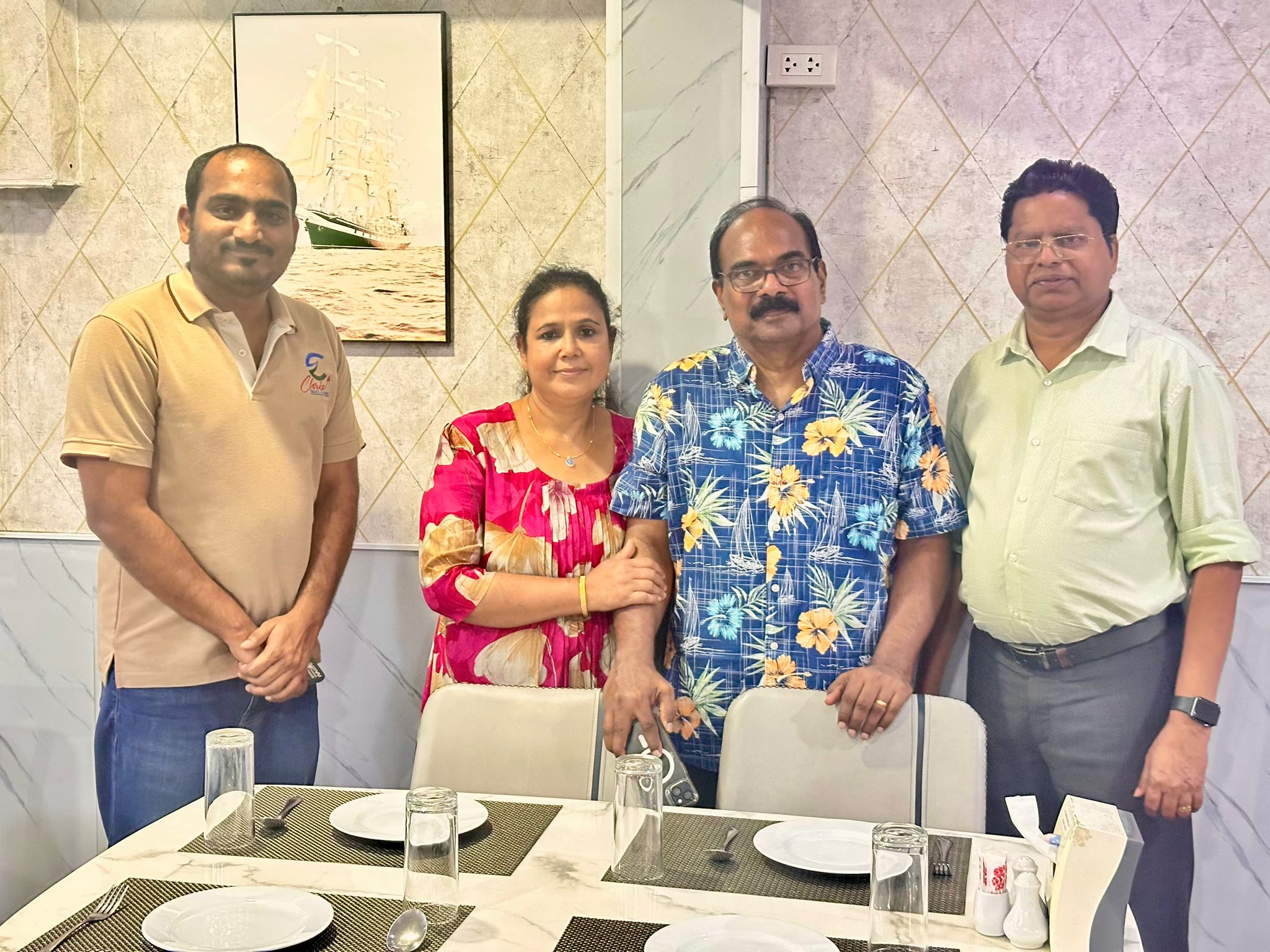 Four Guests Posing Dining Room